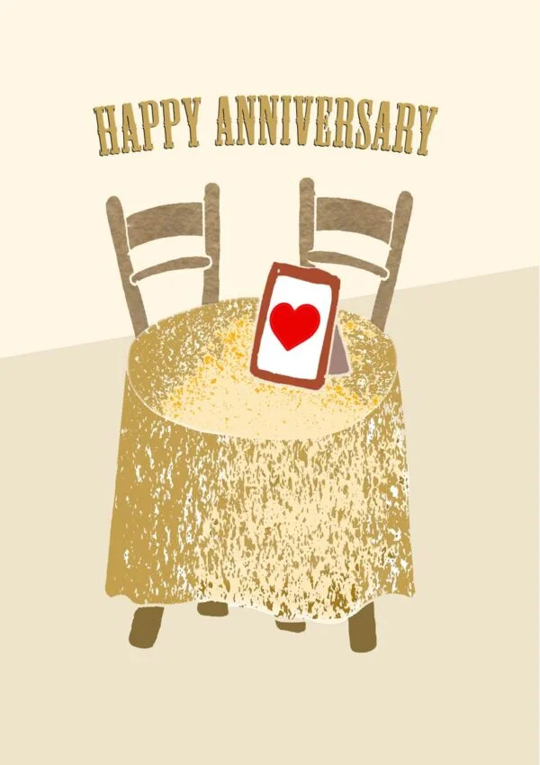A dressing table with a photo frame with hearts and text 'Happy Anniversary'