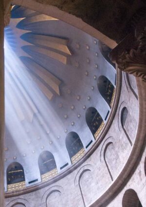 The dome of the Church Of The Holy Sepulchre in Jerusalem looking up with light coming through the oculus