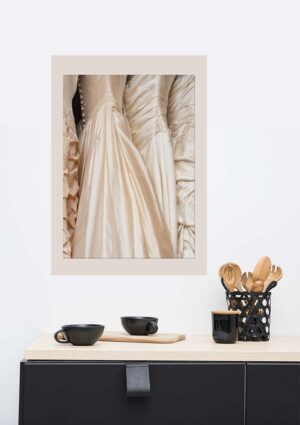 Wedding Dresses poster in situ on a wall in a living room with a sideboard and crockery